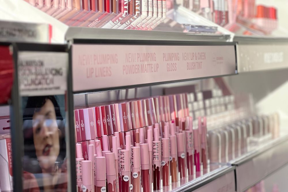 A wall of lip products in a beauty retail store