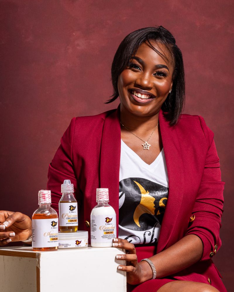 Beauty founder at her desk with skincare products
